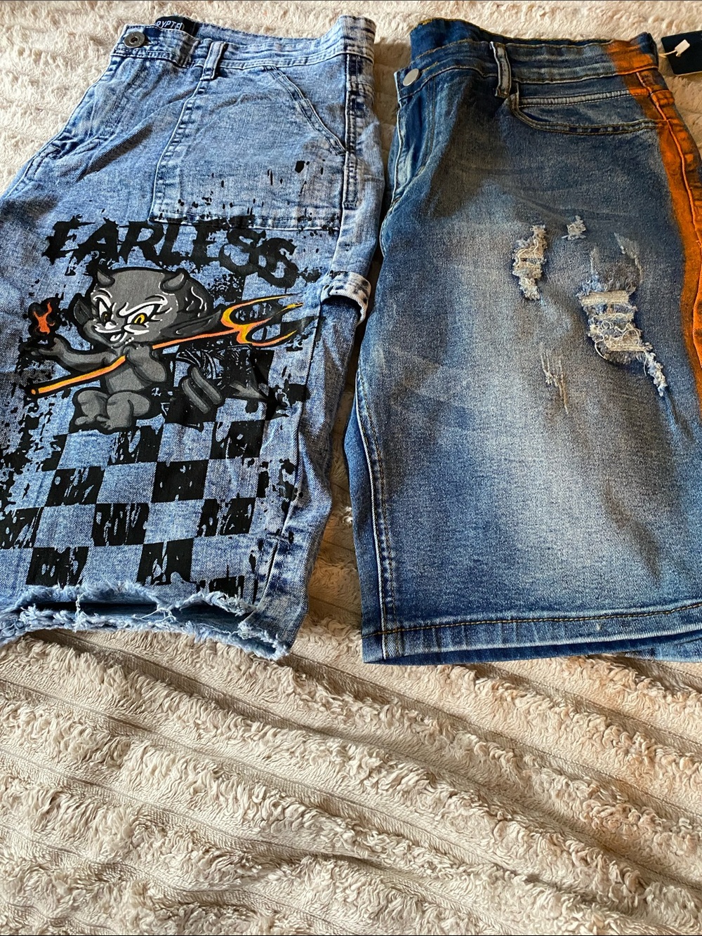 2 Pairs of Men Jean Shorts with Graphics and A Splash of Color 1 size 32 and 34